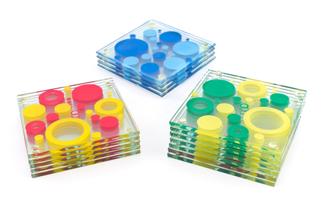 Colorful coasters for glass isolated on whiteの写真素材