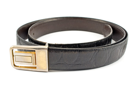 Brown leather belt isolated on whiteの写真素材