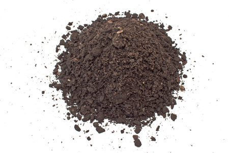 Humus soil pile isolated on whiteの写真素材