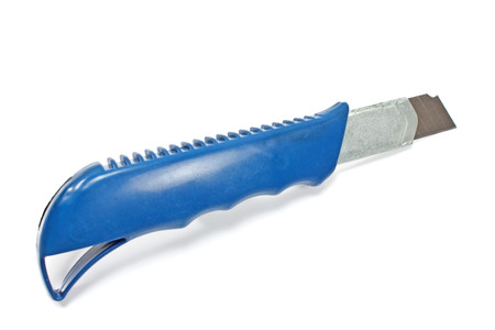 Office paper cutter knife isolated on whiteの写真素材