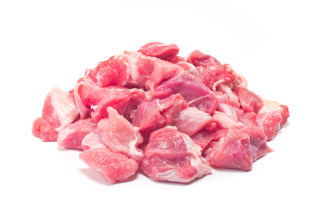 Chopped  pork meat for goulash isolated on whiteの写真素材