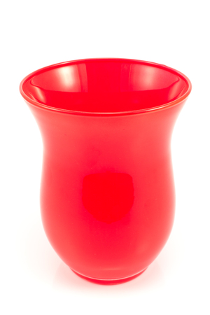 Red glass vase isolated on whiteの写真素材