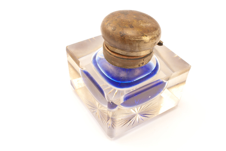Antique crystal inkwell isolated on whiteの写真素材