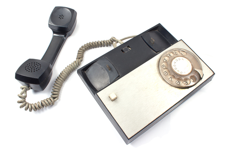 Old telephone isolated on whiteの写真素材