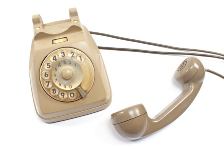 Old telephone isolated on whiteの写真素材