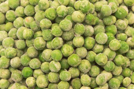 Frozen peas heap as background