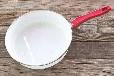 Cooking pan on wooden backgroundの写真素材