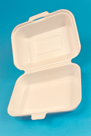 polystyrene box for food isolated on blue backgroundの写真素材