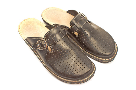 Leather house slippers isolated on white backgroundの写真素材