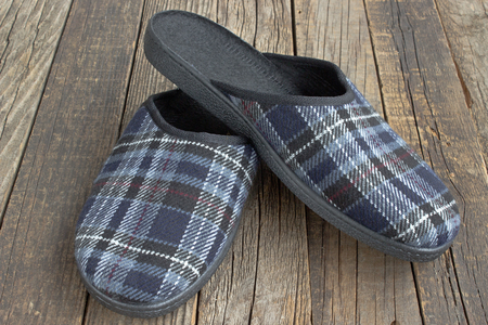House slippers on wooden floor backgroundの写真素材