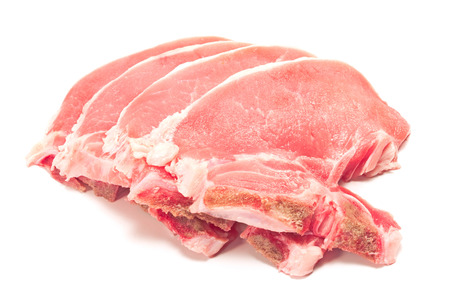 Raw pork chop meat isolated on whiteの写真素材