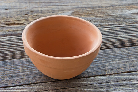 Ceramic bowl on wooden backgroundの写真素材