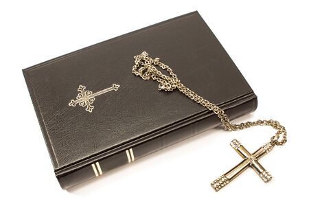 Holy bible with silver cross isolated on white background