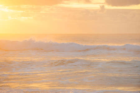Sunrise over the morning sea in gentle tonesの写真素材