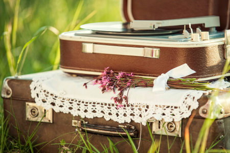 Decor for event or photosession with old brown suitcases and player  recordsの写真素材