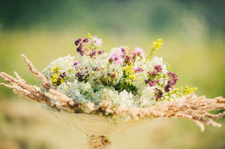 Beautiful summer wildflowers composition. Bouquet for rural weddingの写真素材