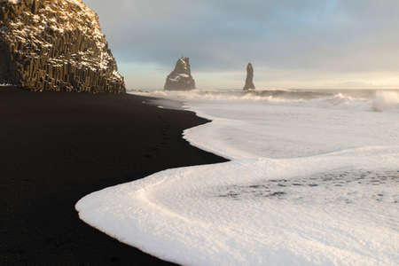 The black sand beach of Reynisfjara and the mount Reynisfjall from the Dyrholaey promontory in the southern coast of Iceland, Vikの写真素材