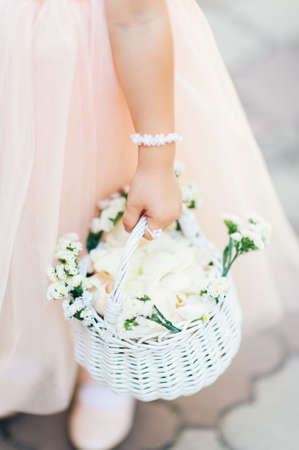 Small flower girl helps get ready for weddingの写真素材