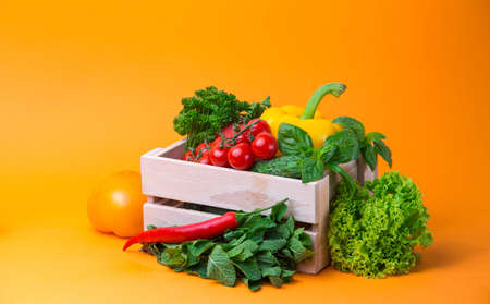 organic food background Vegetables in the basket on the kitchen tableの写真素材