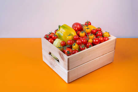 organic food background Vegetables in the basket on the kitchen tableの写真素材