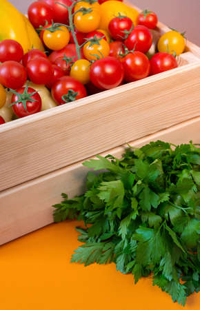 organic food background Vegetables in the basket on the kitchen tableの写真素材