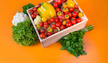 organic food background Vegetables in the basket on the kitchen tableの写真素材