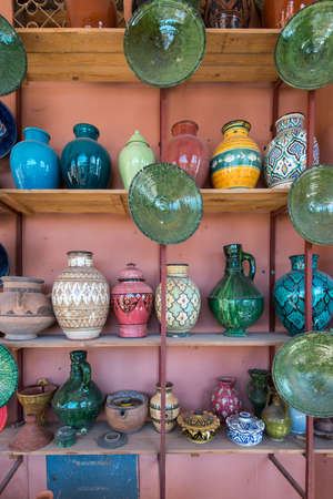 Traditional arabic handcrafted, colorful decorated ceramic for sale at the market in Marrakesh, Morocco, Africaの写真素材