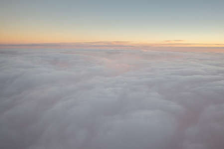 Sunrise above the clouds. view from plane.の写真素材