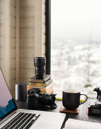 Audio / Video editing workspace office with mountain view. Photography and videography equipment.の写真素材