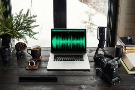 Audio / Video editing workspace office with mountain view. Photography and videography equipment.の写真素材
