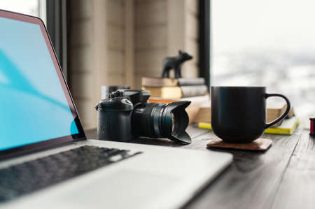 Audio / Video editing workspace office with mountain view. Photography and videography equipment.の写真素材