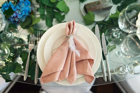 Banquet table is decorated with compositions of hydrangea flowers and greenery