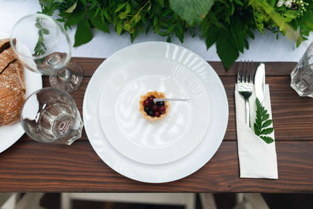 Elegant wedding table arrangement, floral decoration, restaurant. Wedding table setup. Wedding in the forestの写真素材