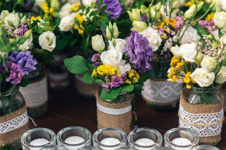 Beautiful flower decorations with candles for the wedding ceremony.の写真素材