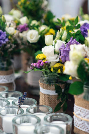 Beautiful flower decorations with candles for the wedding ceremony.の写真素材