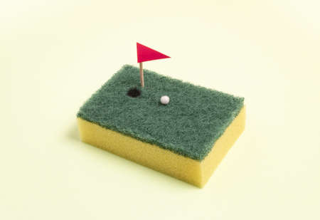 Mini golf course made of sponge, toothpick and cotton wool. Creative sport concept.の写真素材