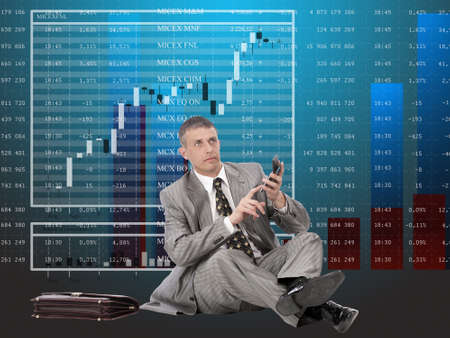 The successful businessman considers financial profit on financial investments