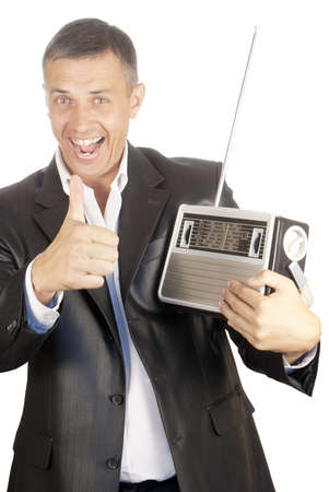 Portrait of the happy smiling man on a white background with a-retro radio receiverの写真素材