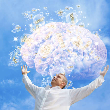 Successful business ideas.Happy businessman with brain in hands