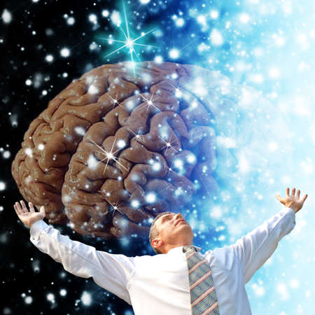 Successful business ideas.Happy businessman with brain in handsの写真素材