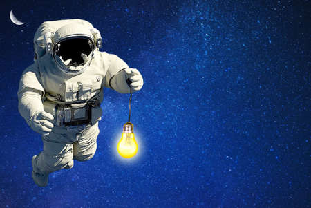 spaceman lighting witch light bulb route in outer space.space travel.