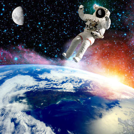 astronaut flying in outer space.