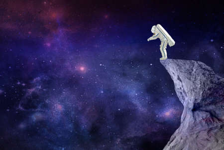 astronaut standing on the rockの写真素材