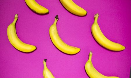 Creative layout made of Bananas on pink background. Food concept.の写真素材