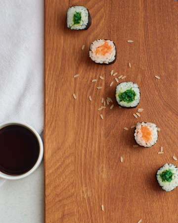 Sushi rolls. Japanese food in the restaurant. Sushi roll with salmon, vegetables close-up