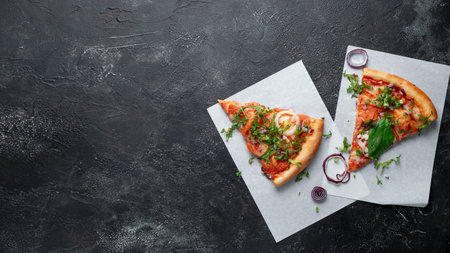 Tasty appetizing vegetarian pizza on dark stone background, top viewの写真素材