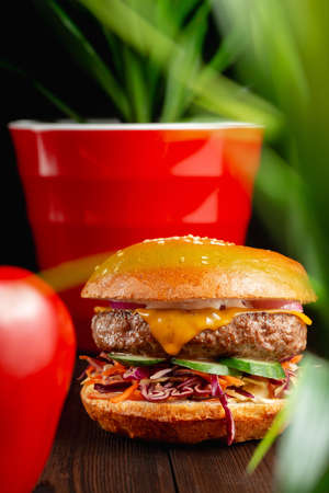 Bright, juicy grilled burgers with beef and cheddar cheese. Fast Food Conceptの写真素材