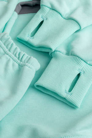 Hoodie texture. Close-up shot of sweatshirt hoodie brown textile warm fabric macro background. blue...