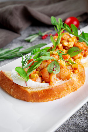 Delicious snacks. Toasted croutons with squid. Bruschetta with seafood and lettuceの写真素材