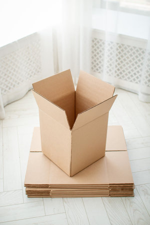 Empty cardboard boxes of large size on a light colored backgroundの写真素材